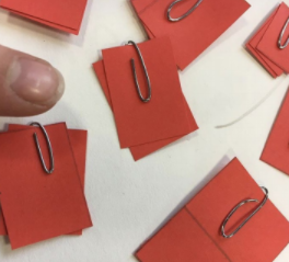 pieces of paper held together with paperclip