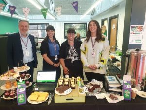 HSDC staff with cake stall